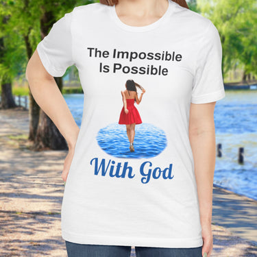 Soft, breathable Bella+Canvas t-shirt made from preshrunk cotton with “Impossible Woman” design message, “The Impossible Is Possible with God,” inspirational shirt encouraging bold obedience and faith-filled movement with God, woman in white t-shirt